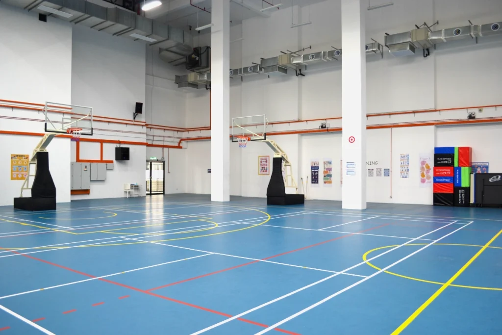The multi-purpose hall caters for indoor sports like badminton, basketball, futsal, netball, trampolining, and volleyball.