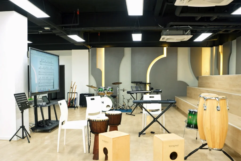 Drum sets and electronic keyboards in the fully-equipped music room at Global Ark Kajang