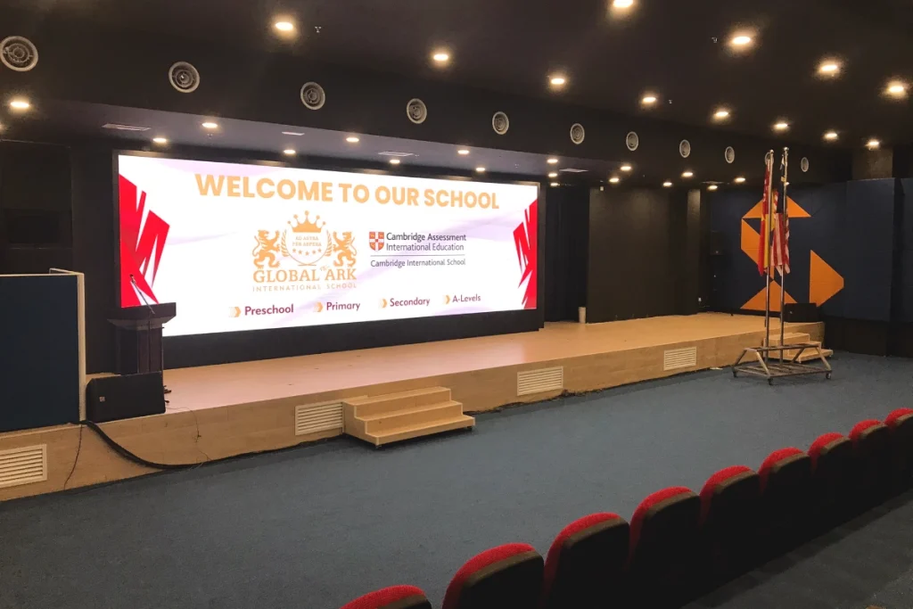 Modern auditorium at Global Ark Kajang featuring a movie theatre setup with a large screen
