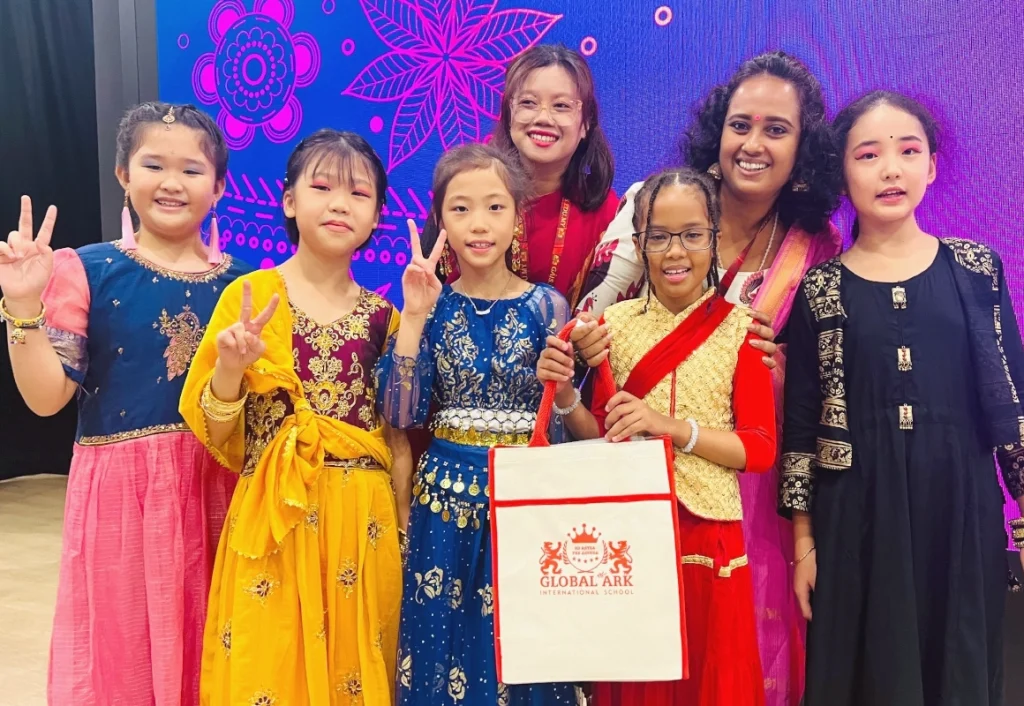 Students receiving award from winning Deepavali dance competition at Global Ark International School